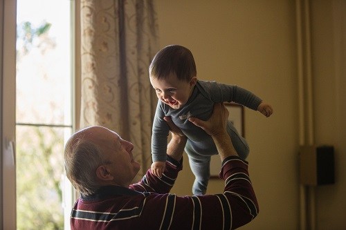 Grandfather playing with grandbaby